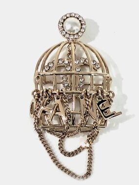 CHANEL  Champagne Gold-Tone Cage Brooch with Pearl and Crystal Accents